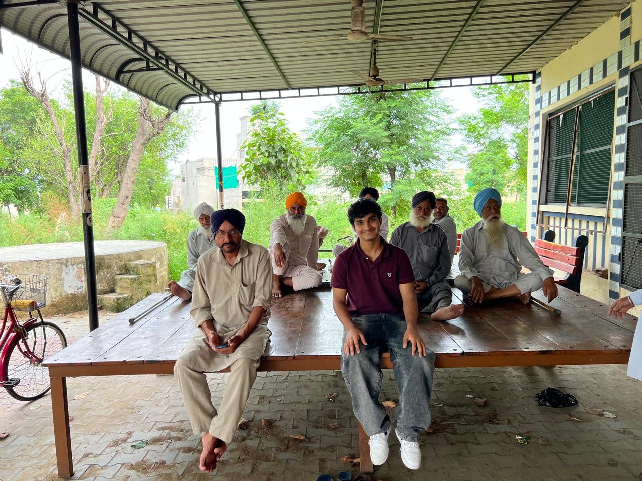 Eclipsion's founder meeting with a group of farmers in rural India